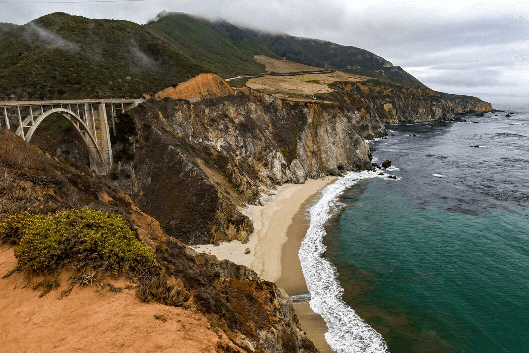 Arial view of the Bixby Bridge at Big Sur along the coastline.
